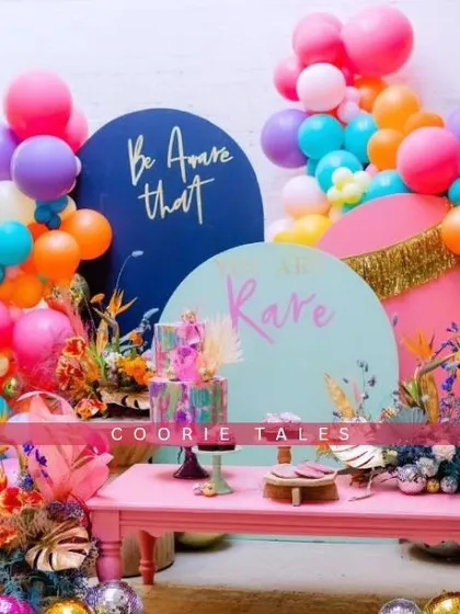 For those who love to live in color, we design vibrant, high-energy celebrations that pop. This setup features a bold and eclectic mix of colorful balloons, floral arrangements, and custom signage for a truly unique and joyful party.