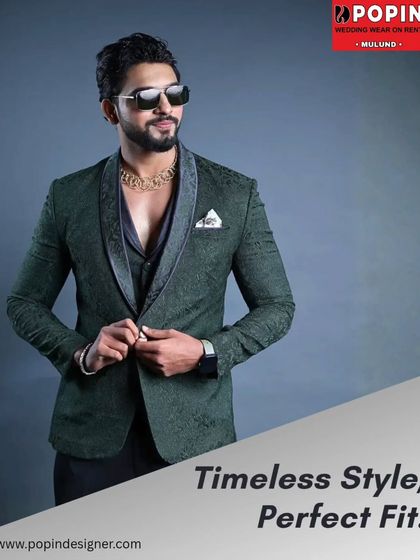 A full look at the textured green designer suit, buttoned up to show its perfect fit. The pocket square adds a final touch of class to this elegant ensemble.