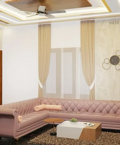 A 3D render showing a comfortable L-shaped sofa in a soft pink fabric, adding a touch of color and elegance to the living room. The textured wall and metal wall art behind the sofa complete the sophisticated look.