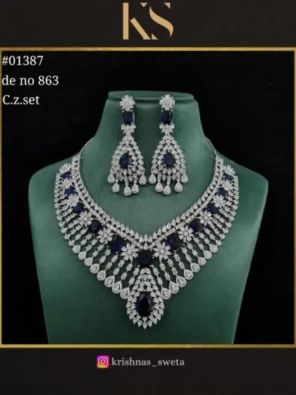 The same C.Z. set in a deep sapphire blue. This rich color is perfect for an evening event and adds a touch of drama to the look.