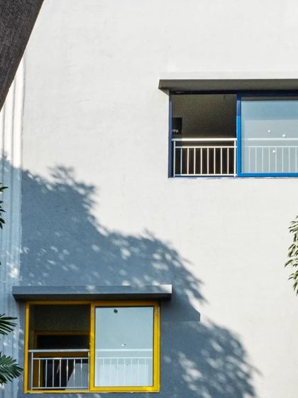 At L'Atelier at Greenwood High Campus, we used pops of color in the window frames to add a playful element to the facade, reflecting its function as an art and music school.