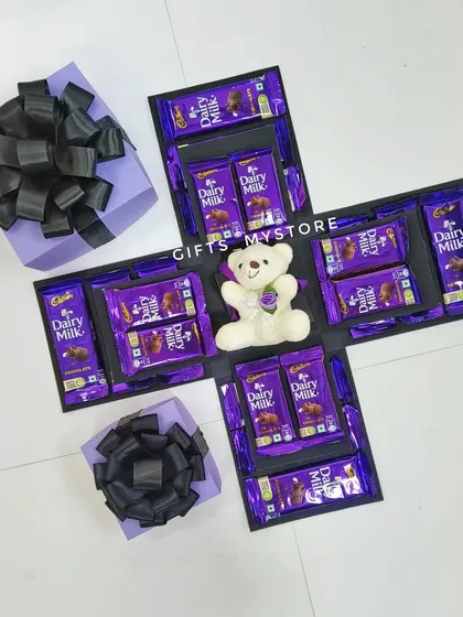 My popular purple-themed Dairy Milk chocolate explosion box, available for under Rs. 1500. It even comes with a cute teddy bear inside.