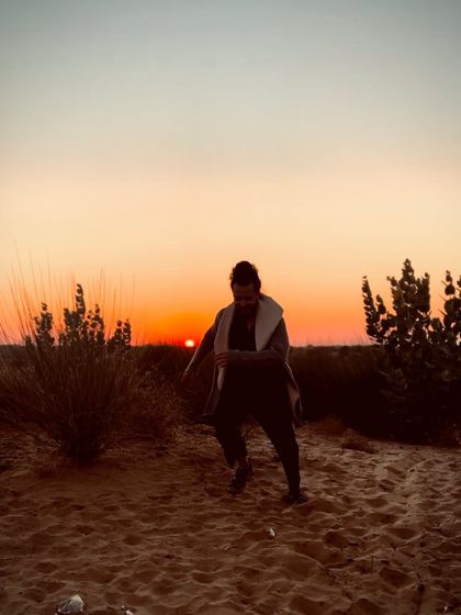 The sun sets over the sand dunes of Rajasthan, a land deeply connected to the origins of Flamenco.