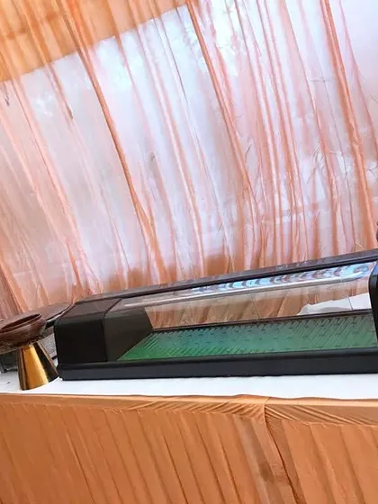 A unique sushi display case integrated into a buffet line, showing our capability to cater to diverse culinary requests, including international cuisines.