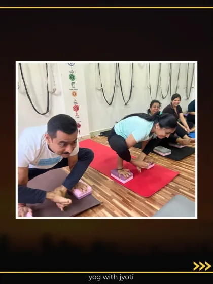 Students using blocks to practice Bhujapidasana (Shoulder-Pressing Pose), a powerful arm balance.