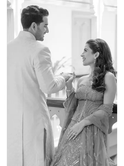 A quiet moment between Karina and Vedant. This black and white portrait, taken in the corridors of the Taj Falaknuma, is all about their gentle connection and the classic architecture.