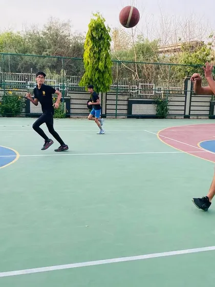 A player makes a quick pass during a fast break. Quick decision-making is key to our style of play.