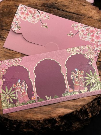 This beautiful pink money envelope features a traditional Indian wedding scene, making it perfect for a shaadi.