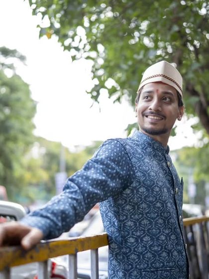 A happy, candid portrait of the groom, Ratnesh, looking dashing in his blue kurta.