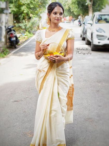 Another look at the Kerala saree drape, perfect for capturing the festive spirit of Onam.