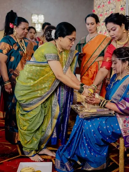 The ritual continues, with blessings and gifts being offered to the bride.