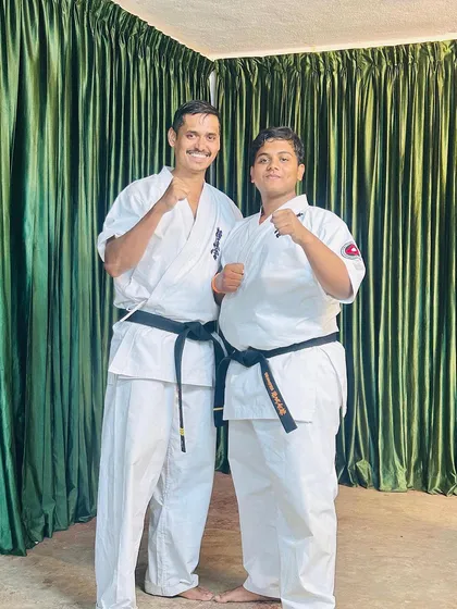 Proud to stand with my student, a new black belt, at our training camp. His hard work and spirit are an inspiration.