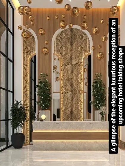 The conceptual render for a luxurious hotel reception. Our design features grand arched backdrops, natural stone textures, and cascading gold light fixtures to create an elegant and memorable first impression for guests.