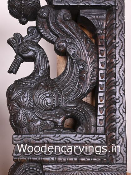 A 26-inch Hamsa bird (Annapakshi) bracket with a dark brown finish. This close-up highlights the intricate patterns carved into the bird's feathers and body.