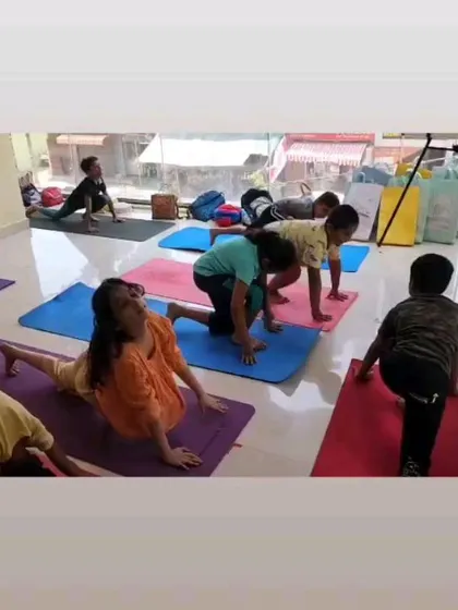 Focus and flexibility in practice. Here, young learners are guided through asanas like a variation of Eka Pada Rajakapotasana (Pigeon Pose), helping them build physical strength, body awareness, and the discipline to hold a posture.