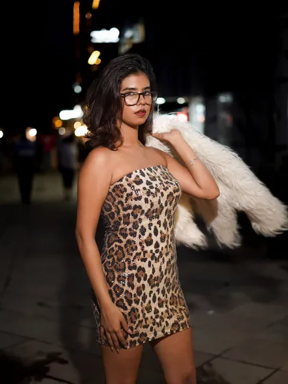 Delhi's streets at night are our playground. This is a great example of a street style shoot, using the city lights to create a bold, confident, and modern portrait.