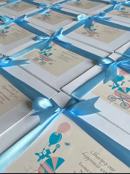 Announcing a new arrival is a precious moment. I had the joy of creating these beautiful baby announcement hampers, complete with personalized cards and delicate blue ribbons to share the happy news with family and friends.