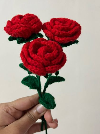 A simple trio of classic red roses I crocheted. These can be gifted as a small bunch or incorporated into a larger, more complex floral bouquet.