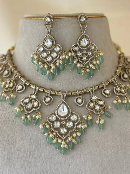 A beautiful polki necklace set with mint-green beads and pearl drops.