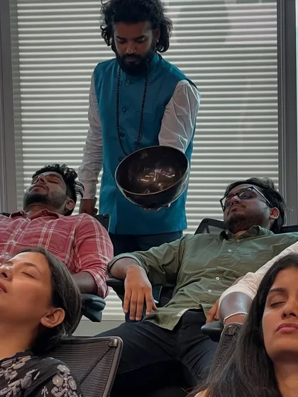 A moment of deep rest during a corporate wellness session. I bring sound healing into the workplace to help teams release stress, improve focus, and find balance in their busy professional lives. A calm mind is a productive mind.