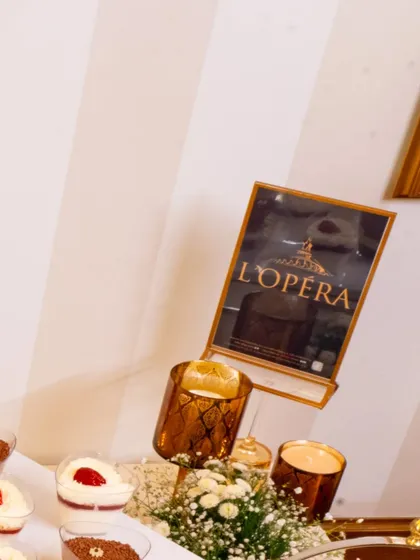 A dessert station featuring individual servings of strawberry and chocolate tiramisu, set against the backdrop of our collaboration with the French patisserie, L'Opéra.