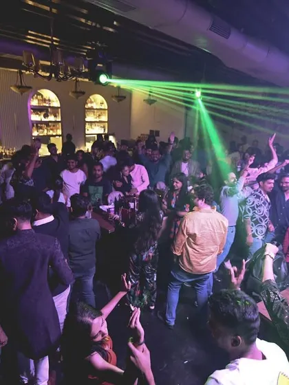 The party in full swing with green laser beams lighting up the dancefloor. The visual experience is just as important as the audio.