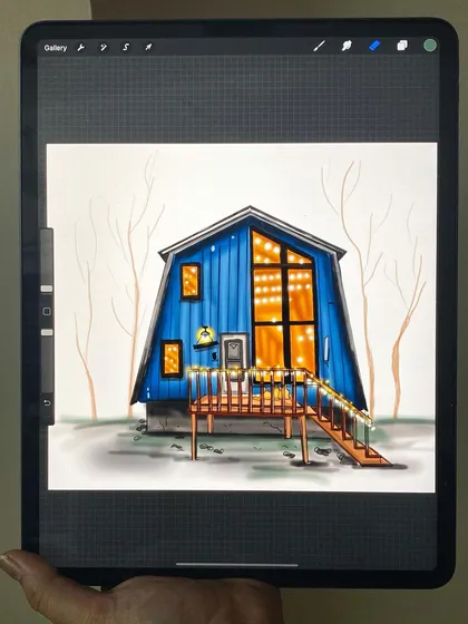A cozy blue cabin illustrated digitally on my iPad. I focused on creating a warm, inviting glow from the windows, contrasting with the cool blue of the house and the bare winter trees.