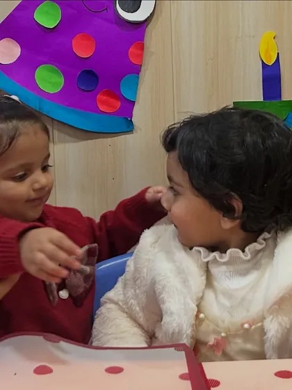 A friend shares a piece of birthday cake. These sweet interactions are where children learn about friendship, sharing, and kindness.