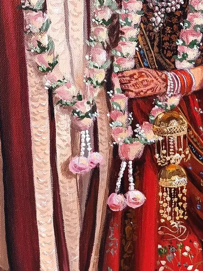 A detail shot focusing on the garlands and the bride's henna-adorned hand in the Pichwai wedding painting.