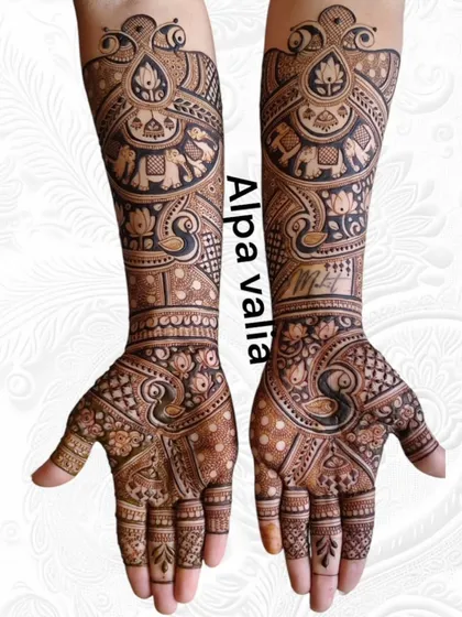 A dense and intricate bridal design featuring a mix of peacock and elephant motifs. The patterns flow seamlessly from the palm to the elbow.