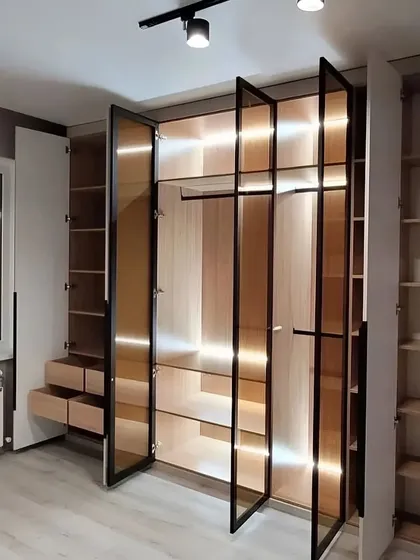 This angle shows how the wardrobe integrates with the room, even accommodating a radiator. Every design is customized to fit the unique challenges and features of your space.