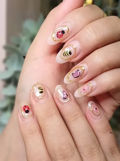 A full set of our framed bug and bear nail art. It's whimsical, detailed, and a total conversation starter.