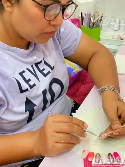 This student is practicing her brush skills, creating a design on a practice wheel.