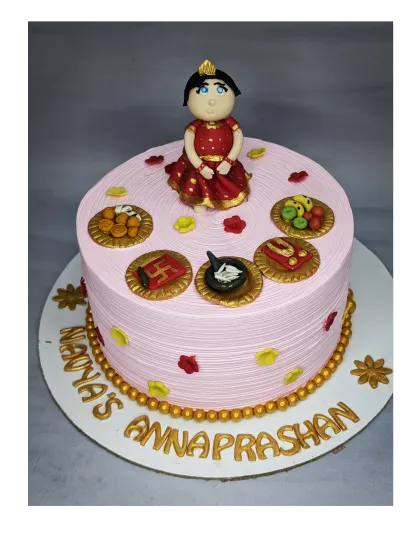 A special cake for an Annaprashan ceremony, which marks a baby's first taste of solid food. This fresh pineapple cake is decorated with traditional and symbolic fondant toppers.