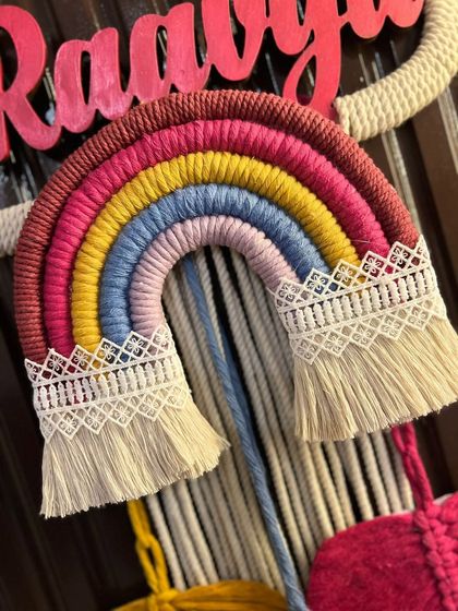 A detailed close-up of the rainbow element. This shows the careful wrapping of the cotton cord and the delicate lace trim I add to the clouds for a touch of elegance.