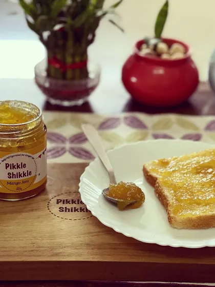 Start your morning with the sweet and tangy taste of our homemade Mango Jam. It is like sunshine on a slice of bread, made with real mangoes and no artificial flavours.