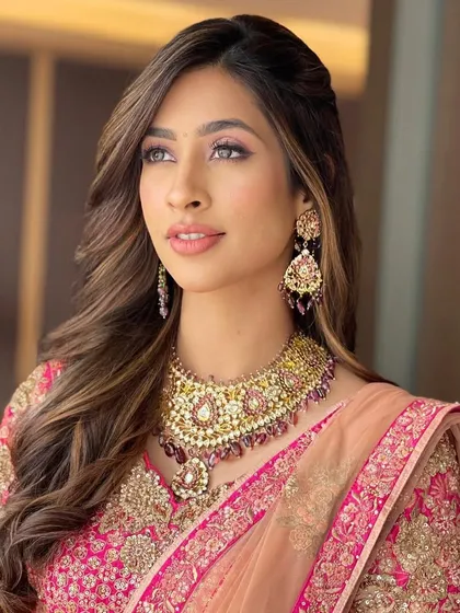 A beautiful portrait of the bride, her soft, voluminous hair adding to the romantic feel.
