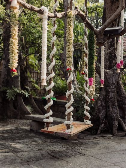 Our iconic swing, wrapped in fragrant jasmine garlands, ready for the traditional 'oonjal' ceremony or for romantic couple portraits.