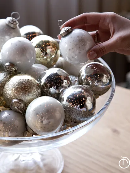 A closer look at the exquisite, handmade glass ball ornaments from my Christmas Shop. The mix of milky white, speckled, and shimmering silver finishes adds a sophisticated and magical touch to any holiday decor.