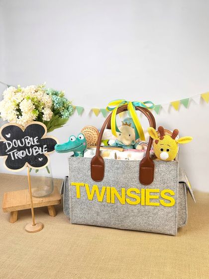 A fun and vibrant 'Twinsies' hamper for twins. The shot includes cute animal toys and a 'Double Trouble' sign, perfectly capturing the playful theme.