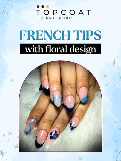 A modern twist on a classic. This design features dark blue French tips with abstract swirls and delicate, hand-painted floral accents.