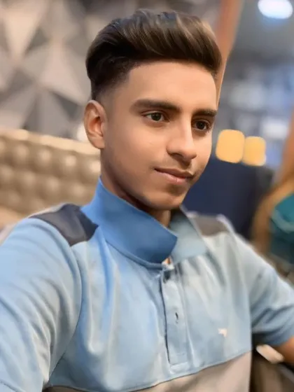 A fresh and clean haircut for a young client. This style features a high fade with a voluminous, styled top.