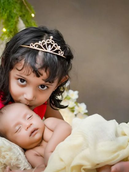 A princess and her new, tiny subject. I love creating these storybook moments, where a big sister's love and protection for her new sibling shines through.