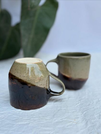 Another view of our half-half mug, showing how the two glazes meet and overlap. Each one will have its own unique pattern.