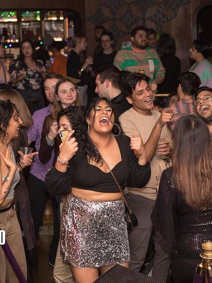 The crowd singing along at Bollywood Disco. It's a night filled with nostalgia, celebrating the songs we all grew up with, remixed for the dance floor.