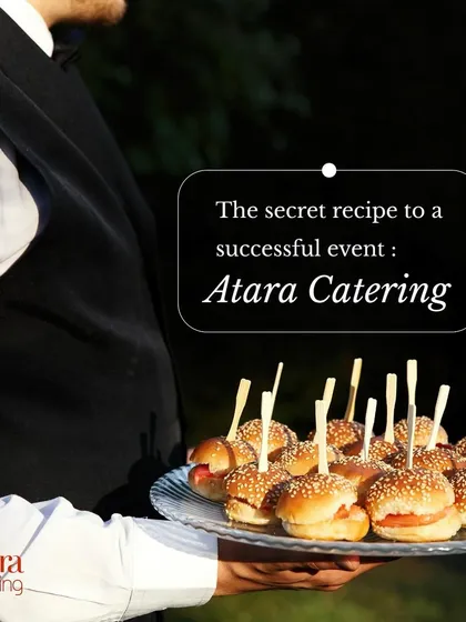The secret recipe to a successful event is Atara Catering. Our professional server carries a tray of mini burgers, representing our commitment to excellent service.