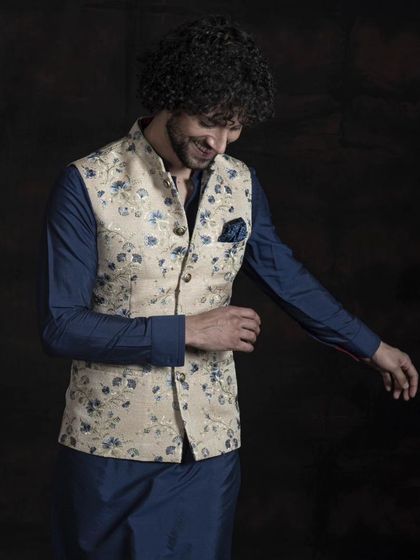 A candid shot showing the comfortable fit and stylish appeal of the floral Nehru jacket. It’s a perfect example of how traditional wear can be both elegant and easy to wear.