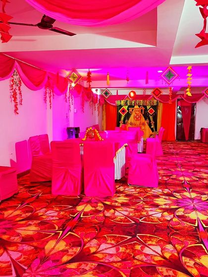 Another view of the pink-themed hall, highlighting the main backdrop and the overall festive arrangement.