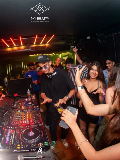 Interacting with the crowd while spinning some 2000s gems. The energy at M Bar is always infectious.
