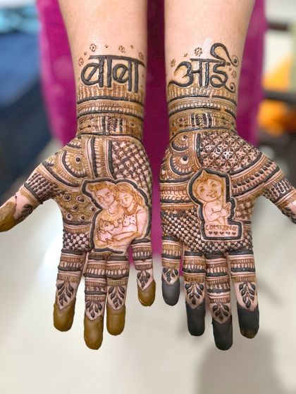 A heartwarming baby shower mehendi design. It features a portrait of the family with their new baby, with "Baba" and "Aai" written in Marathi to honor the grandparents to be.